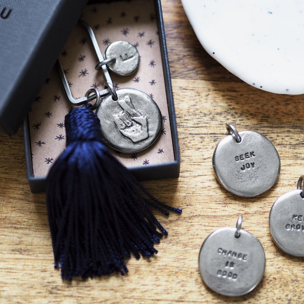 Motto Coin + Tassel Keyring